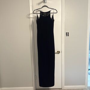 Black Velvet formal gown with detail beads on the front and back of dress.